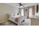 Bright bedroom features plush carpeting, a ceiling fan, and a comfortable bed at 18 Brandon Ridge Dr, Sandy Springs, GA 30328