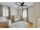 Charming Bedroom with a ceiling fan, hardwood floors, and two windows for natural light at 18 Brandon Ridge Dr, Sandy Springs, GA 30328