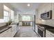 Charming kitchen with white cabinetry, modern stainless steel appliances, and a cozy breakfast nook at 18 Brandon Ridge Dr, Sandy Springs, GA 30328