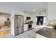 Beautiful kitchen featuring stainless steel appliances and seamless flow to the living room at 18 Brandon Ridge Dr, Sandy Springs, GA 30328