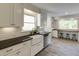 Beautiful kitchen featuring custom cabinets, sleek countertops, and an adjacent dining space at 18 Brandon Ridge Dr, Sandy Springs, GA 30328