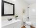 Modern bathroom features sleek black fixtures and clean white tiling at 247 Mandy Ct, Mcdonough, GA 30252