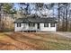 Charming single-story home with a covered porch and a well-maintained lawn at 247 Mandy Ct, Mcdonough, GA 30252