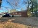 View of backyard showing the rear brick exterior of the home at 2736 Claire Ter, Decatur, GA 30032