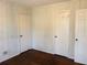 Bedroom featuring hardwood floors and paneled walls at 2736 Claire Ter, Decatur, GA 30032