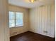 Bedroom featuring paneled walls and hardwood flooring at 2736 Claire Ter, Decatur, GA 30032