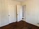 Bedroom with hardwood floors and paneled walls at 2736 Claire Ter, Decatur, GA 30032