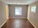 Bedroom with hardwood floors, neutral walls, and a window for natural light at 2736 Claire Ter, Decatur, GA 30032