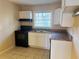 Efficient kitchen with modern appliances, ample cabinet space, and tile flooring at 2736 Claire Ter, Decatur, GA 30032