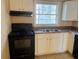 Practical kitchen featuring modern appliances, white cabinetry, and natural light at 2736 Claire Ter, Decatur, GA 30032