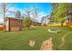 Spacious backyard with lawn, partial brick hardscape and wooden fence at 3020 Norton Se Ct, Smyrna, GA 30082