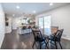 Inviting dining area connected to the kitchen featuring modern lighting and hexagonal tile flooring at 3020 Norton Se Ct, Smyrna, GA 30082