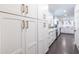 Bright kitchen with white cabinets, modern appliances, and dark hexagon tile flooring at 3020 Norton Se Ct, Smyrna, GA 30082