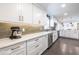 Well-lit kitchen with modern appliances, sleek countertops, and ample storage space in white cabinets at 3020 Norton Se Ct, Smyrna, GA 30082