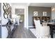 Bright dining room with hard wood flooring and furniture, and decorative wall mirrors at 509 Vervain Drive, Locust Grove, GA 30248