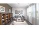 Formal dining area features chandelier lighting above a table set for eight, and wooden shelves at 509 Vervain Drive, Locust Grove, GA 30248