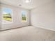 Neutral bedroom featuring plush carpeting, two bright windows, and ample natural light at 674 Sundial Ln, Mableton, GA 30126