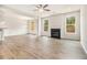 Spacious living room featuring a fireplace, hardwood floors, and bright windows at 674 Sundial Ln, Mableton, GA 30126