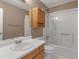 Full bathroom with a shower and tub combination, wood cabinets, and a white countertop at 105 Lakeview Ln, Stockbridge, GA 30281