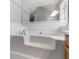 Bathroom showcasing a soaking tub with tile surround and a wooden vanity at 105 Lakeview Ln, Stockbridge, GA 30281