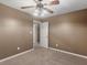 Neutral bedroom featuring plush carpeting, a ceiling fan, and natural lighting from one window at 105 Lakeview Ln, Stockbridge, GA 30281