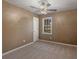 Neutral bedroom featuring plush carpeting, a ceiling fan, and natural lighting from one window at 105 Lakeview Ln, Stockbridge, GA 30281