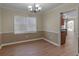 Open dining room area with modern chandelier and plenty of natural light at 105 Lakeview Ln, Stockbridge, GA 30281