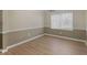 Dining room with bright natural light, neutral walls, and modern light fixture at 105 Lakeview Ln, Stockbridge, GA 30281