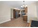 Bright dining room with stainless steel refrigerator and wood cabinets at 105 Lakeview Ln, Stockbridge, GA 30281