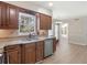 Kitchen featuring granite countertops, stainless steel appliances, and wooden cabinets at 105 Lakeview Ln, Stockbridge, GA 30281