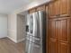 Kitchen featuring stainless steel refrigerator and wood cabinets at 105 Lakeview Ln, Stockbridge, GA 30281