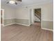 Spacious living room showcasing neutral paint, flooring, and staircase entrance at 105 Lakeview Ln, Stockbridge, GA 30281