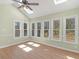 Inviting sunroom with vaulted ceilings, fan, skylights, and multiple windows at 105 Lakeview Ln, Stockbridge, GA 30281