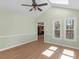 Bright sunroom showcasing vaulted ceilings, fan, skylights, and large windows at 105 Lakeview Ln, Stockbridge, GA 30281