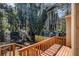 Wooden deck with a wood fence and a view of the backyard and shed at 5293 Oakridge Dr, Stone Mountain, GA 30083