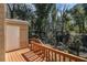 A wooden deck with stairs leading to the yard and a shed at 5293 Oakridge Dr, Stone Mountain, GA 30083