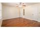 Bright bedroom with hardwood floors, ceiling fan, and ensuite bathroom at 5293 Oakridge Dr, Stone Mountain, GA 30083