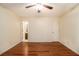 This bedroom features hardwood floors, neutral walls, and a ceiling fan with light at 5293 Oakridge Dr, Stone Mountain, GA 30083