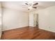 Bedroom with hardwood floors, a ceiling fan, and access to bathroom at 5293 Oakridge Dr, Stone Mountain, GA 30083