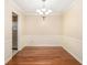 Inviting dining room with chair rail molding and a modern chandelier at 5293 Oakridge Dr, Stone Mountain, GA 30083