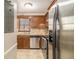 Kitchen featuring stainless appliances, and stone backsplash at 5293 Oakridge Dr, Stone Mountain, GA 30083