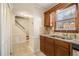 Bright kitchen with tile floors, stainless steel sink, and granite countertops at 5293 Oakridge Dr, Stone Mountain, GA 30083