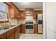 Kitchen featuring stainless appliances, tile backsplash, and granite countertops at 5293 Oakridge Dr, Stone Mountain, GA 30083