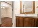 Charming powder room with a wooden vanity and view of the dining room at 5293 Oakridge Dr, Stone Mountain, GA 30083