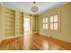 Bedroom with hardwood floors, built in shelves, and natural light at 231 Peachtree Ne Way, Atlanta, GA 30305