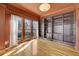 Comfortable room with beautiful wood floors and built-in bookshelves, perfect for relaxation or entertainment at 231 Peachtree Ne Way, Atlanta, GA 30305