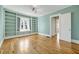 Bright living room with hardwood floors, built in bookshelves, and large windows at 231 Peachtree Ne Way, Atlanta, GA 30305