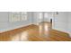 Spacious living room with natural light from windows, complemented by hardwood flooring at 231 Peachtree Ne Way, Atlanta, GA 30305