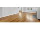 Spacious living room with hardwood floors and a fireplace, creating a cozy and inviting atmosphere at 231 Peachtree Ne Way, Atlanta, GA 30305