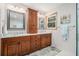 Bathroom featuring dual sinks, granite countertops, and wood cabinetry at 487 Glendale Ct, Stone Mountain, GA 30087